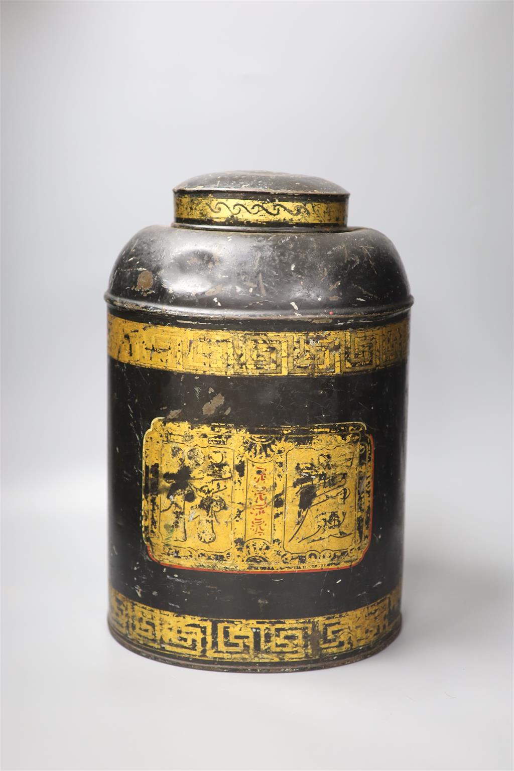 A large late 19th / early 20th century Chinese toleware tea canister, the cover with embossed characters, decorated with a central scri
